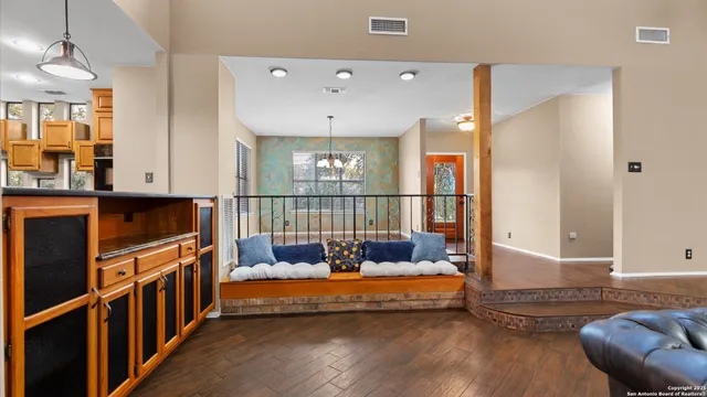 a bedroom with furniture and a window