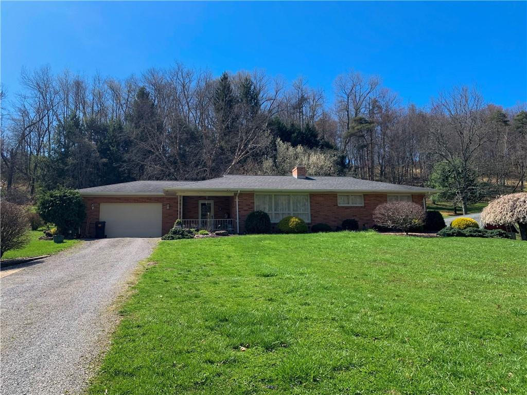 153 State Rte 1035 Kittanning, PA 16201 - Photo 1 of 14 a front view of a house with garden