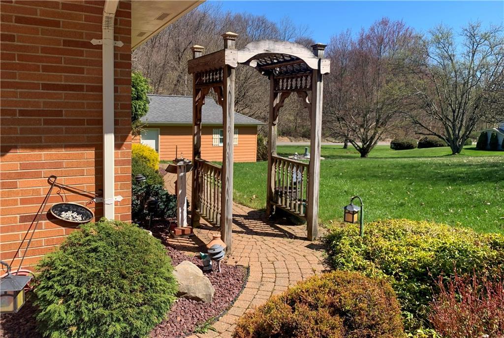 153 State Rte 1035 Kittanning, PA 16201 - Photo 14 of 14 a view of a backyard with sitting area and garden