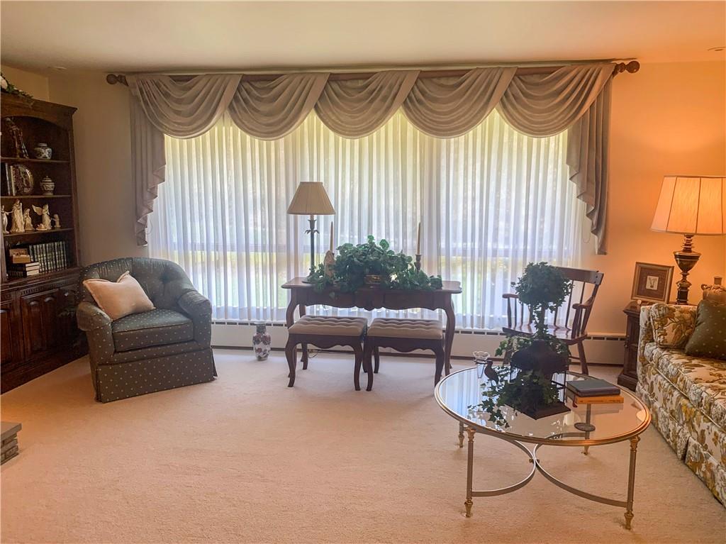 153 State Rte 1035 Kittanning, PA 16201 - Photo 2 of 14 a living room with furniture and a lamp