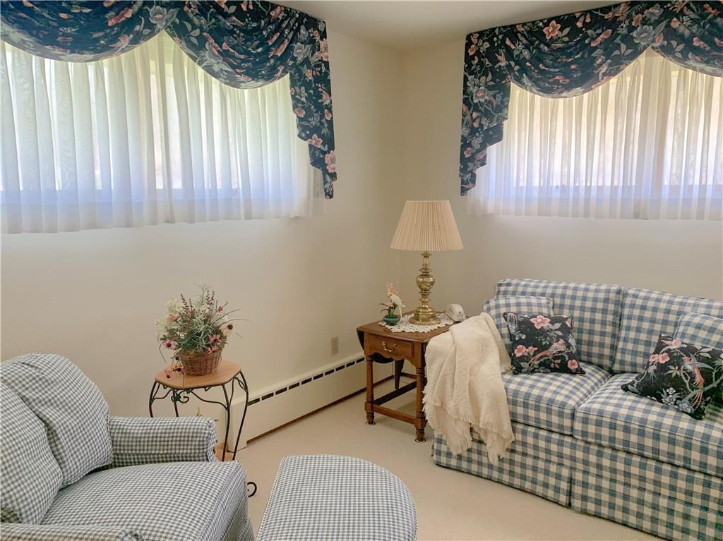 153 State Rte 1035 Kittanning, PA 16201 - Photo 7 of 14 a bedroom with a bed and a chair