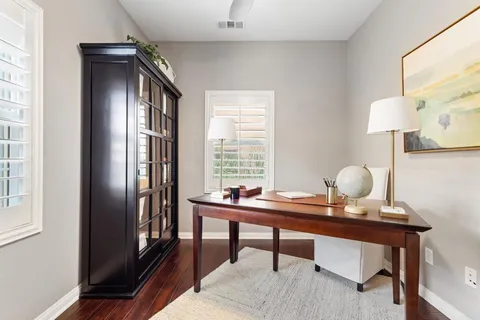 a work room with furniture and a window