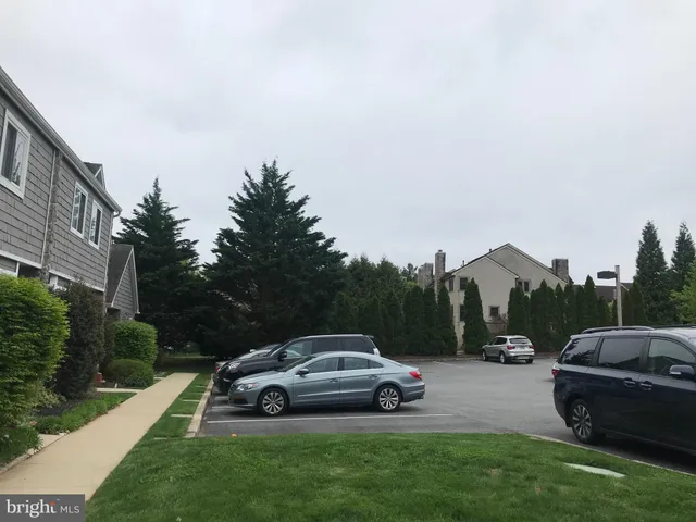 a view of hallway with wooden floor