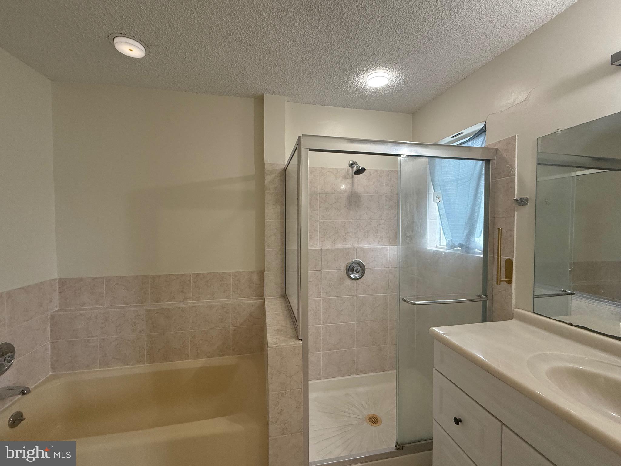 52 Constitution Court Chesterbrook, PA 19087 - Photo 15 of 35 a bathroom with a shower sink and mirror