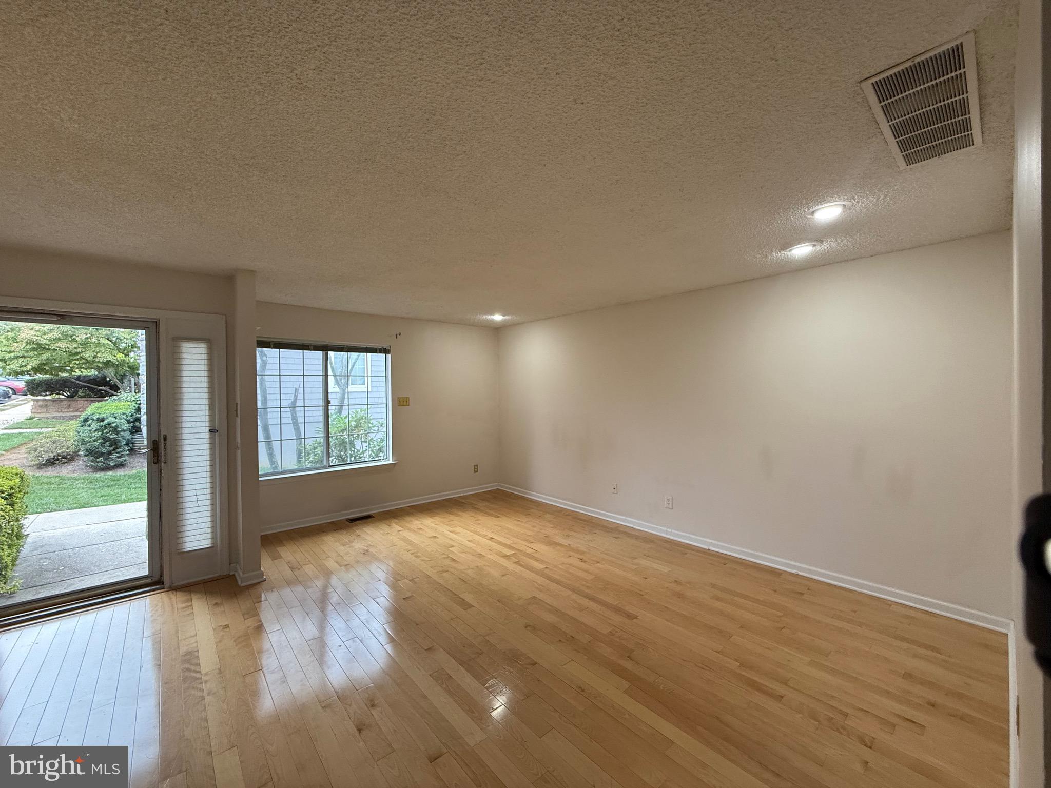 52 Constitution Court Chesterbrook, PA 19087 - Photo 32 of 35 an empty room with wooden floor and windows