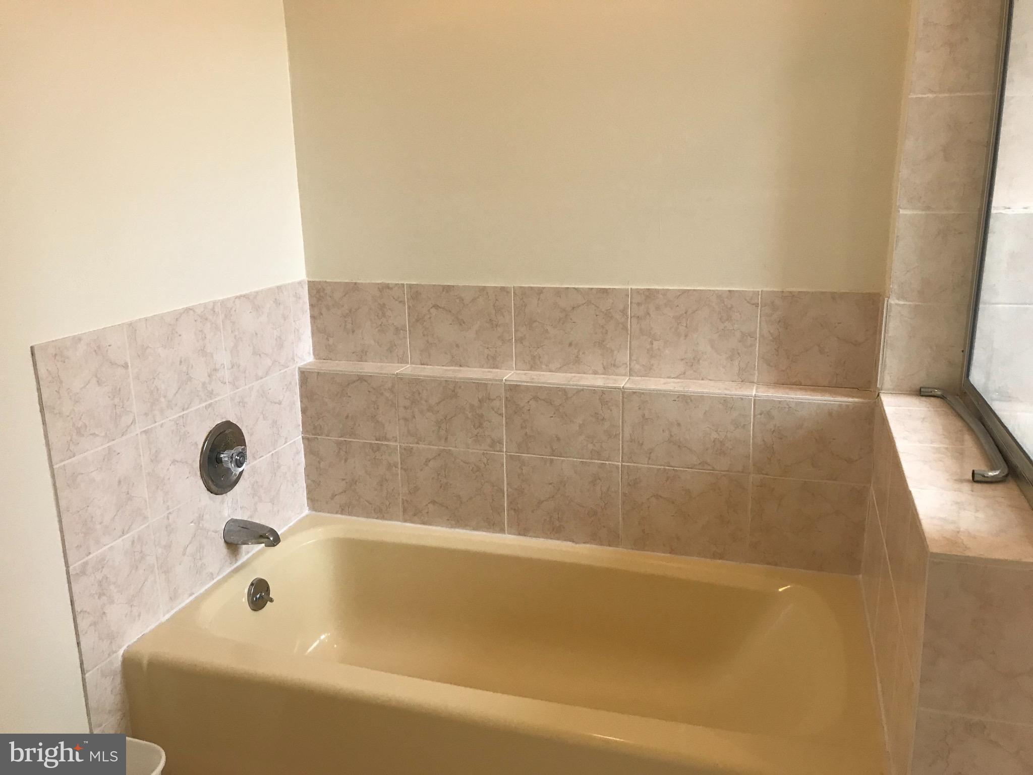 52 Constitution Court Chesterbrook, PA 19087 - Photo 4 of 35 a bathroom with a bathtub