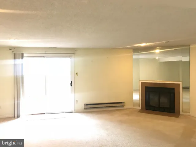 a bathroom with a shower sink and mirror