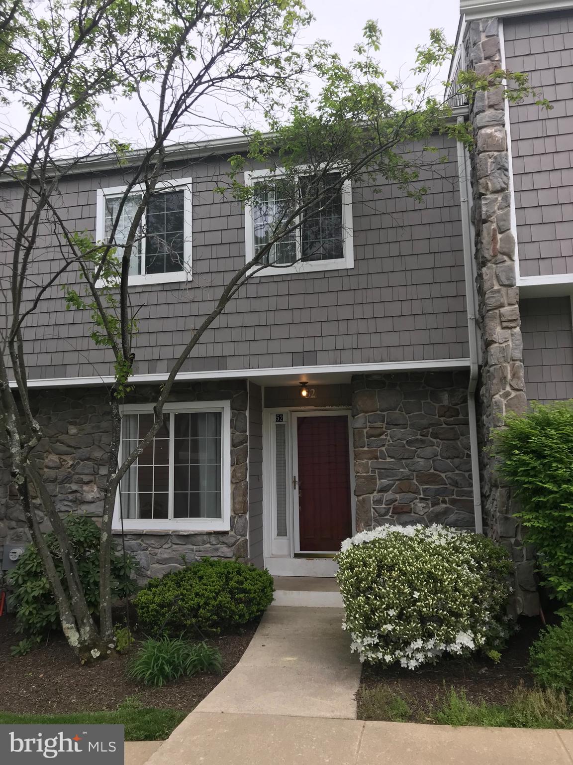 52 Constitution Court Chesterbrook, PA 19087 - Photo 10 of 35 a front view of a house with garden