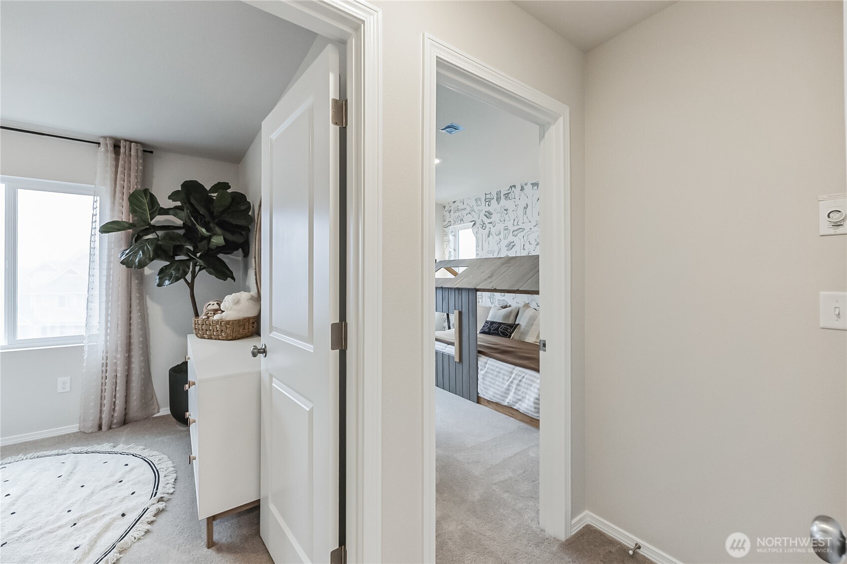 34156 Emerald Ridge Avenue Southeast Black Diamond, WA 98010 - Photo 16 of 24 a view of a bedroom with a wardrobe space