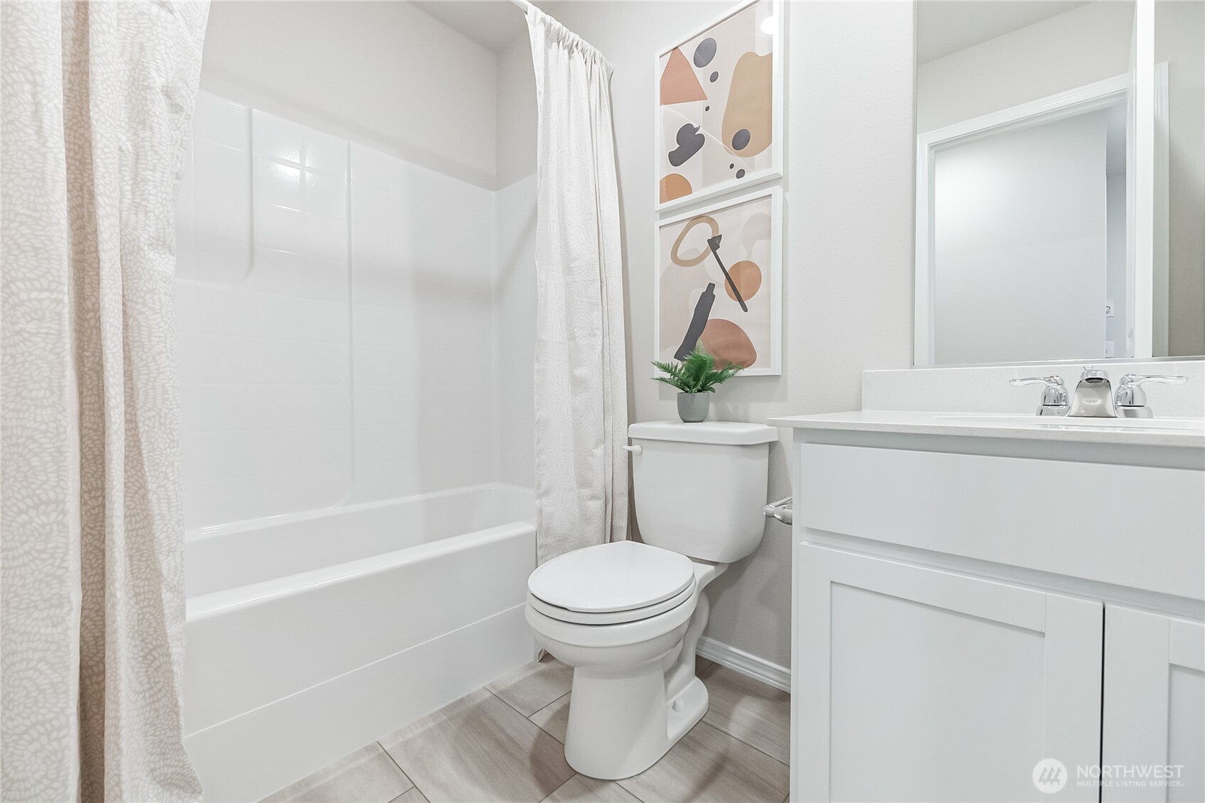 34156 Emerald Ridge Avenue Southeast Black Diamond, WA 98010 - Photo 19 of 24 a bathroom with a bathtub and a toilet