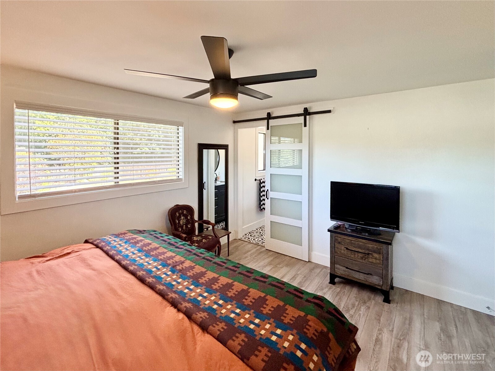 715 Liberty Place Walla Walla, WA 99362 - Photo 11 of 32 a bedroom with a bed and a flat screen tv