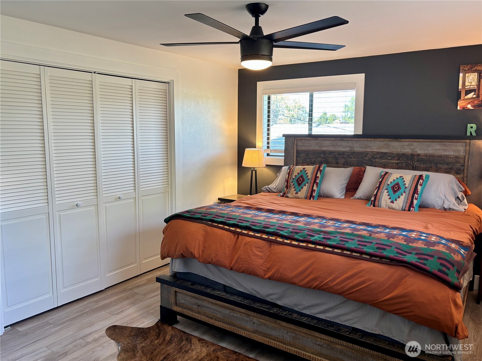 715 Liberty Place Walla Walla, WA 99362 - Photo 12 of 32 a bedroom with a bed and wooden floor