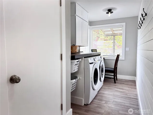 a view of a kitchen with washer and dryer