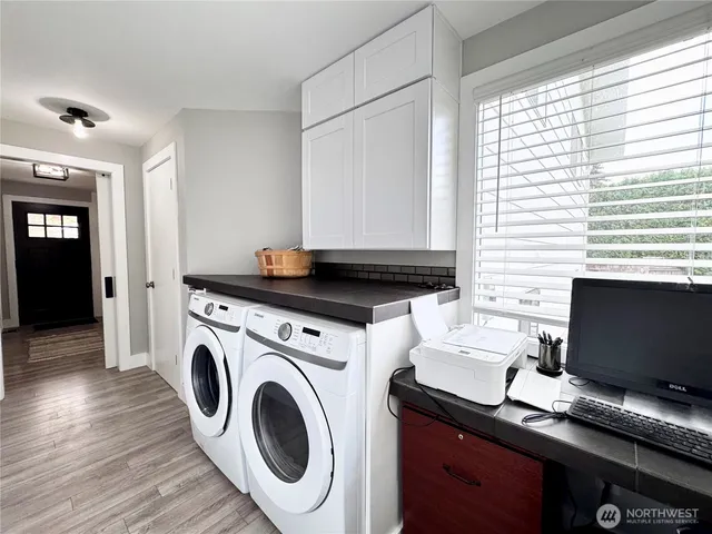 a view of workspace with wooden floor washer and dryer