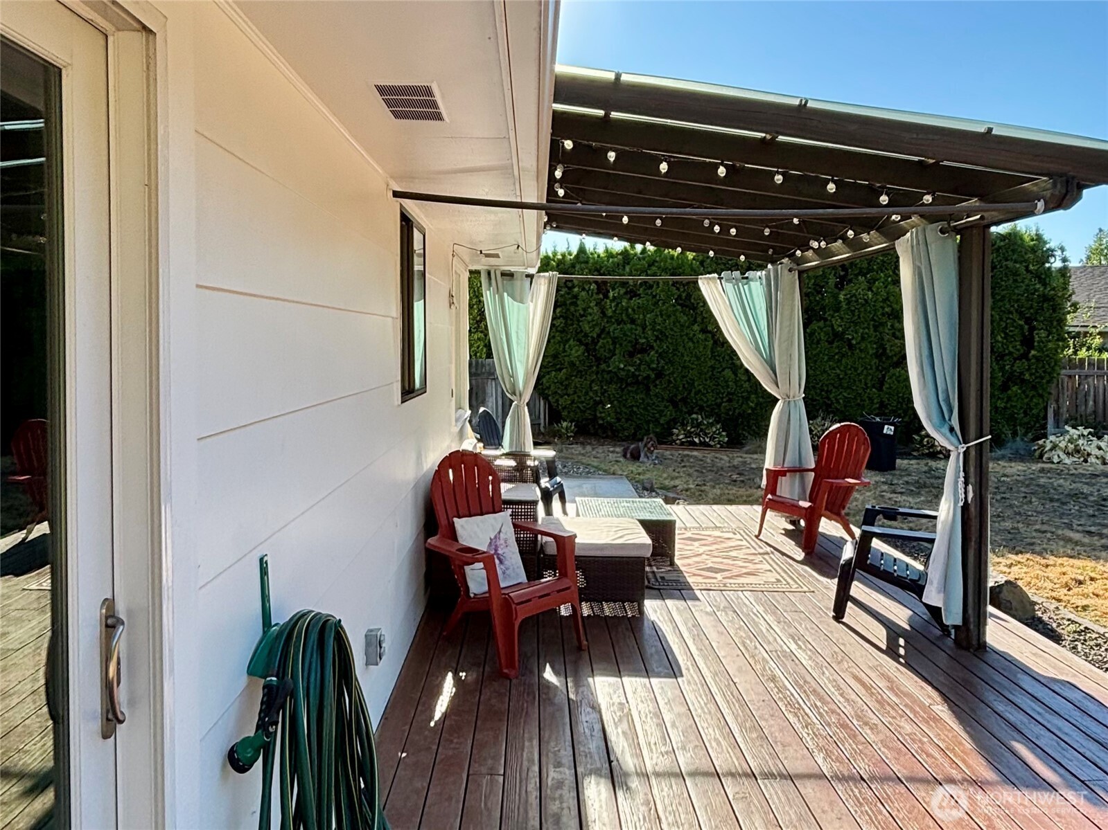 715 Liberty Place Walla Walla, WA 99362 - Photo 30 of 32 a view of chairs and table in patio with wooden floor