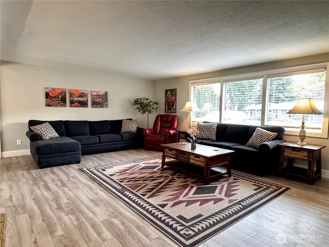 a living room with furniture and a rug