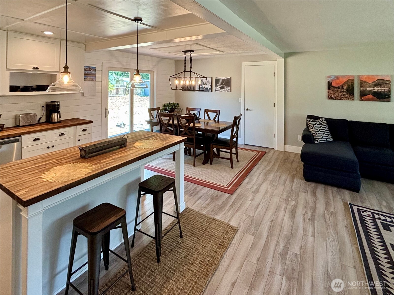 715 Liberty Place Walla Walla, WA 99362 - Photo 8 of 32 a kitchen with stainless steel appliances granite countertop table chairs and a wooden floors