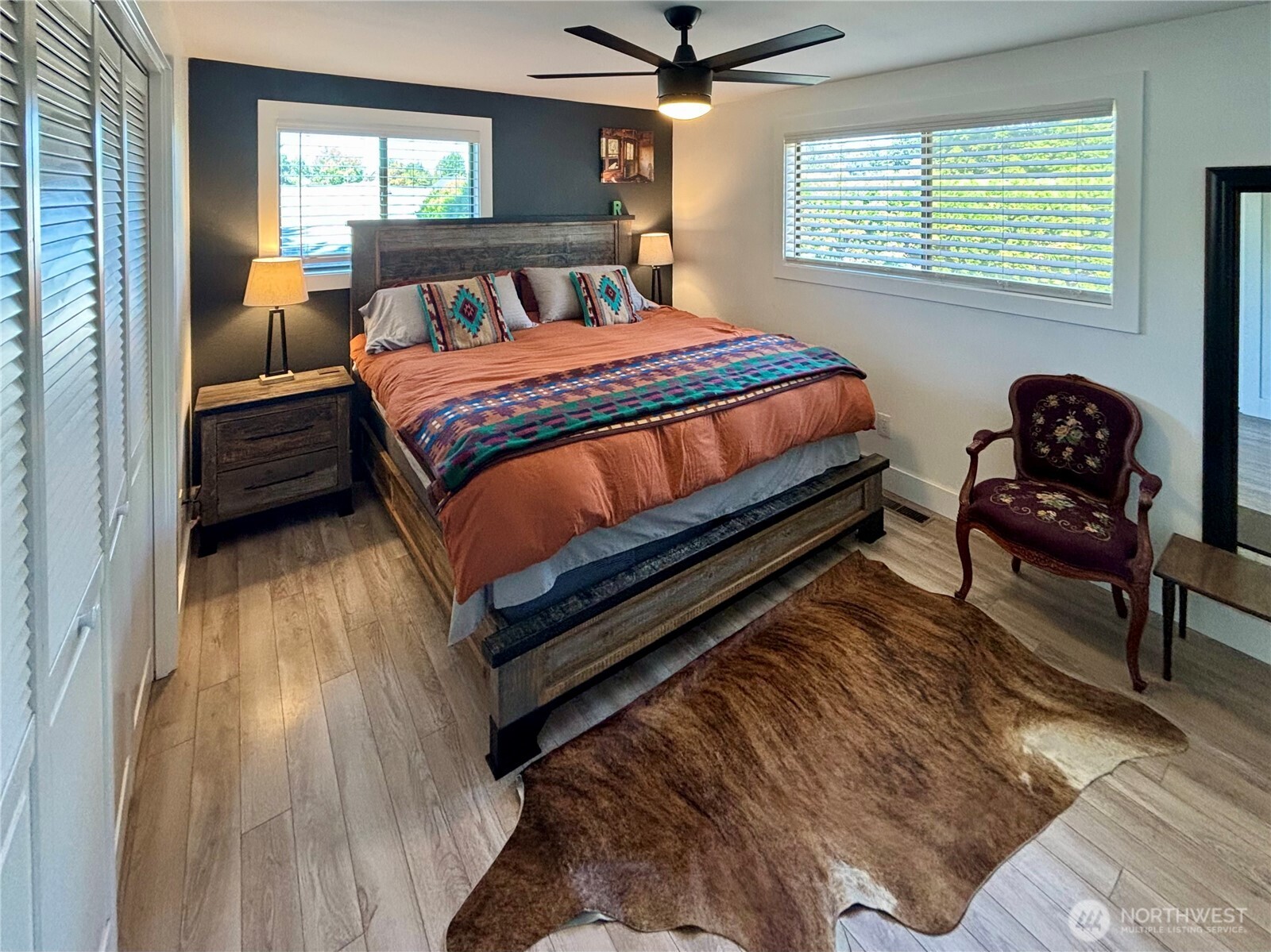 715 Liberty Place Walla Walla, WA 99362 - Photo 10 of 32 a bedroom with a bed and wooden floor
