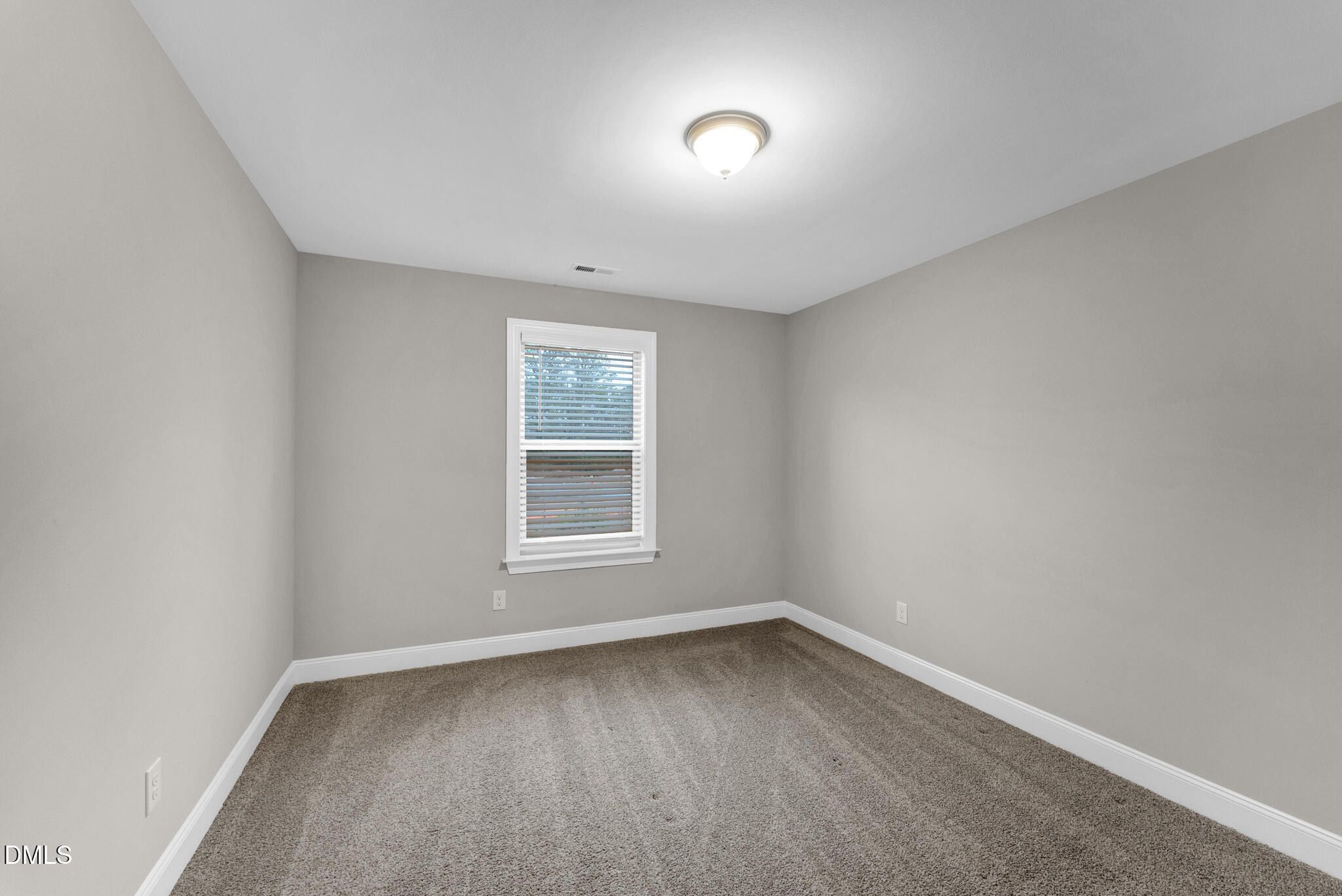 928 Barringer Drive Raleigh, NC 27606 - Photo 22 of 40 an empty room with a window