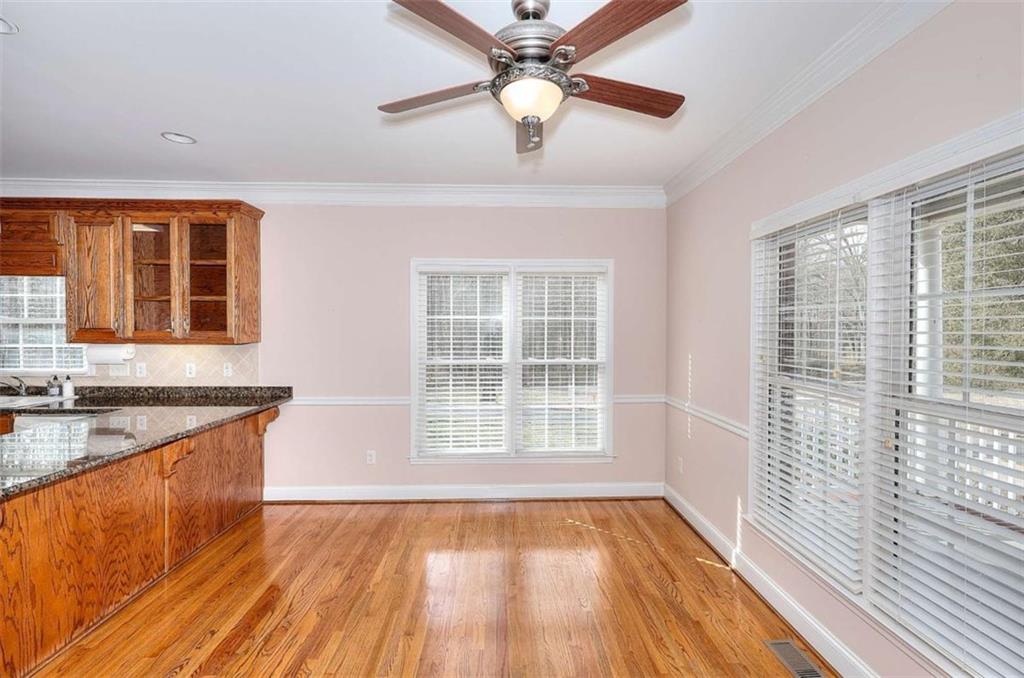 1799 Eliza Doster Road Monroe, GA 30656 - Photo 11 of 60 a view of a kitchen with a sink and wooden floor