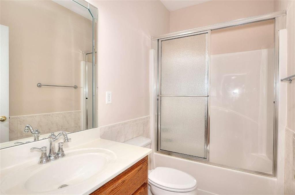 1799 Eliza Doster Road Monroe, GA 30656 - Photo 24 of 60 a bathroom with a sink and a mirror