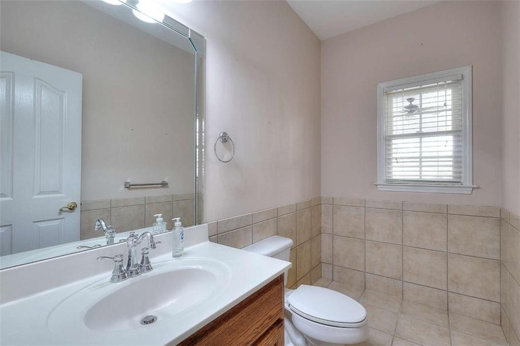 1799 Eliza Doster Road Monroe, GA 30656 - Photo 32 of 60 a bathroom with a sink a toilet and shower