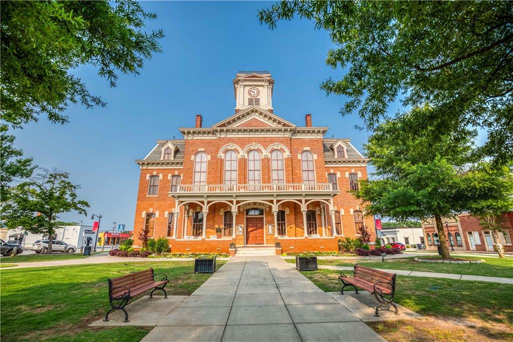 1799 Eliza Doster Road Monroe, GA 30656 - Photo 55 of 60 a front view of a building with garden