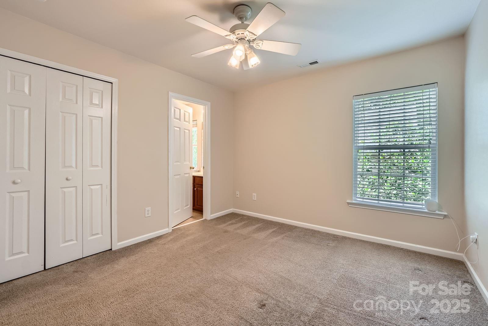 10132 Caldwell Depot Road Cornelius, NC 28031 - Photo 19 of 28 an empty room with windows and fan
