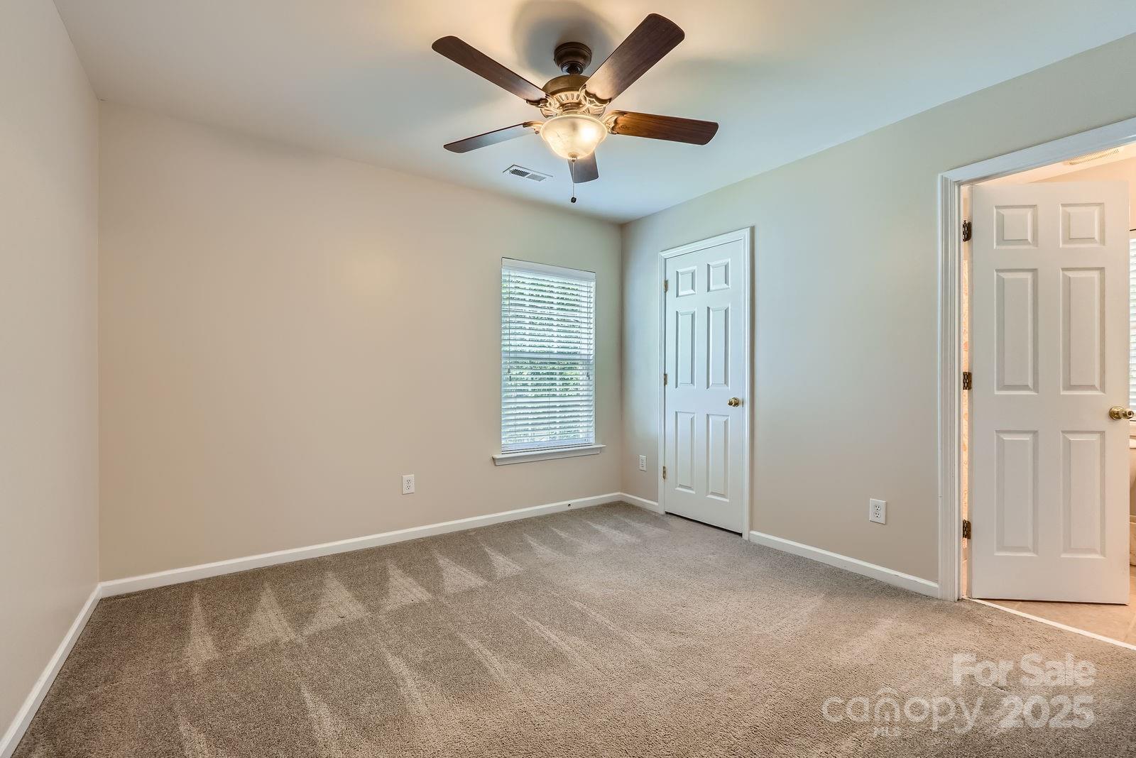 10132 Caldwell Depot Road Cornelius, NC 28031 - Photo 21 of 28 a view of an empty room with a window