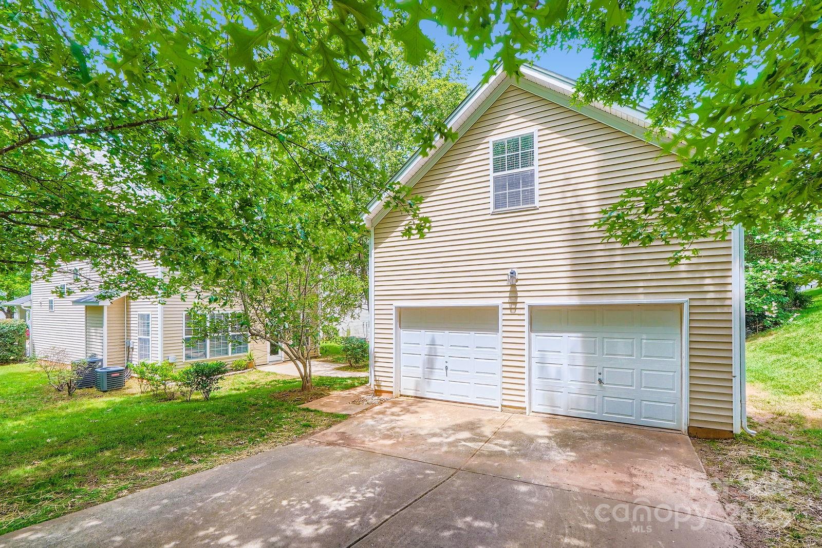 10132 Caldwell Depot Road Cornelius, NC 28031 - Photo 26 of 28 a view of a house with a yard and large tree