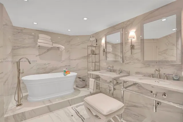 a bathroom with a sink a toilet and bathtub