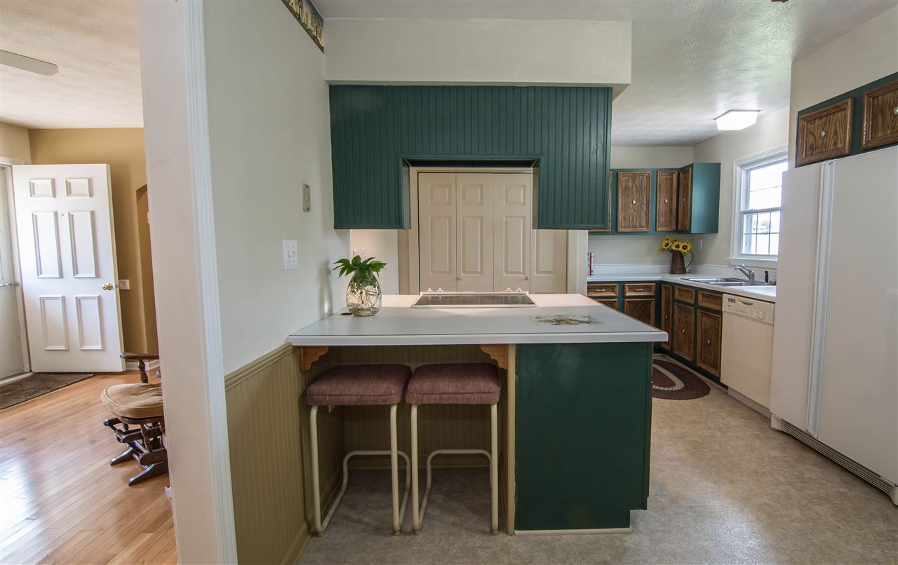 2638 Spaders Church Road Harrisonburg, VA 22801 - Photo 8 of 19 a kitchen with a table and chairs in it