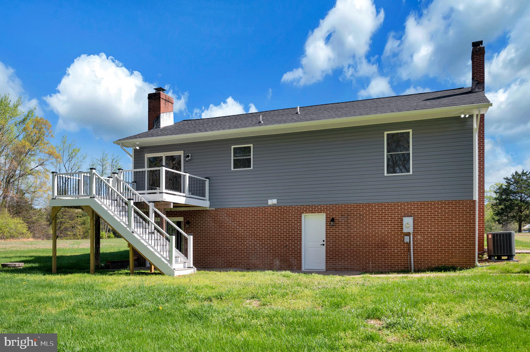 13452 Post Oak Road Spotsylvania, VA 22551 - Photo 12 of 56 a front view of a house with a yard