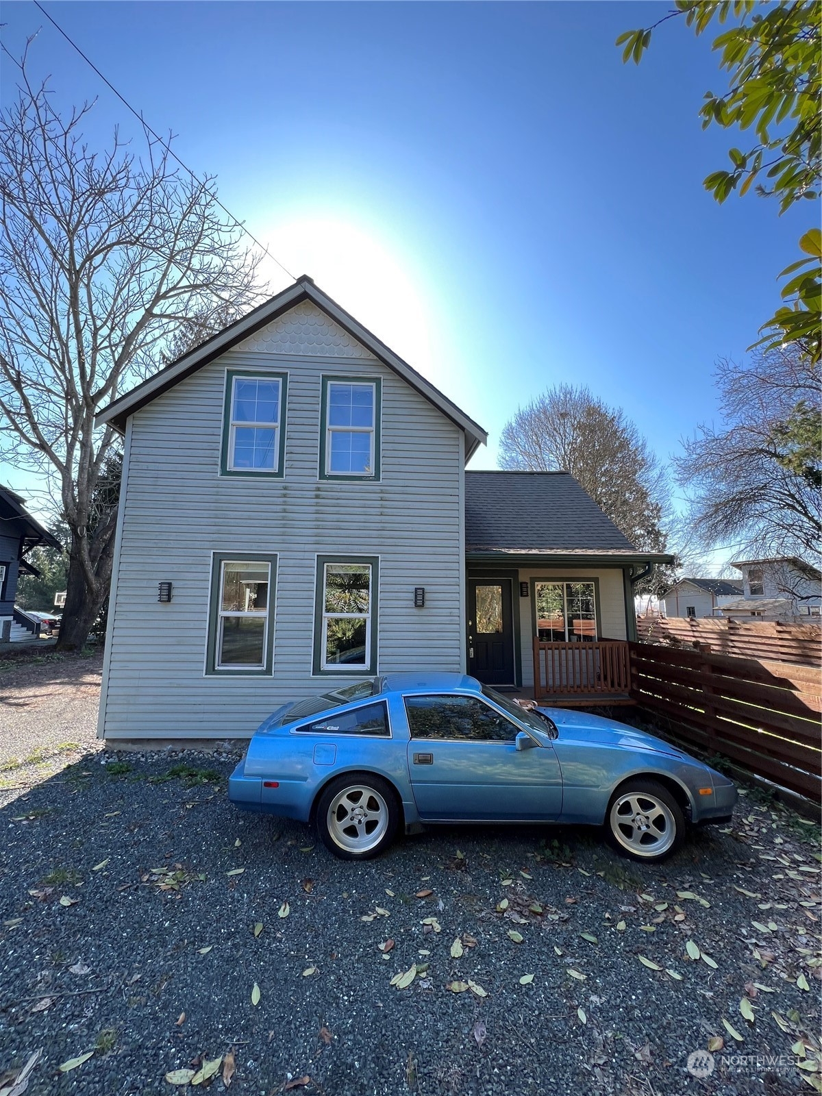 a car parked in front of a house