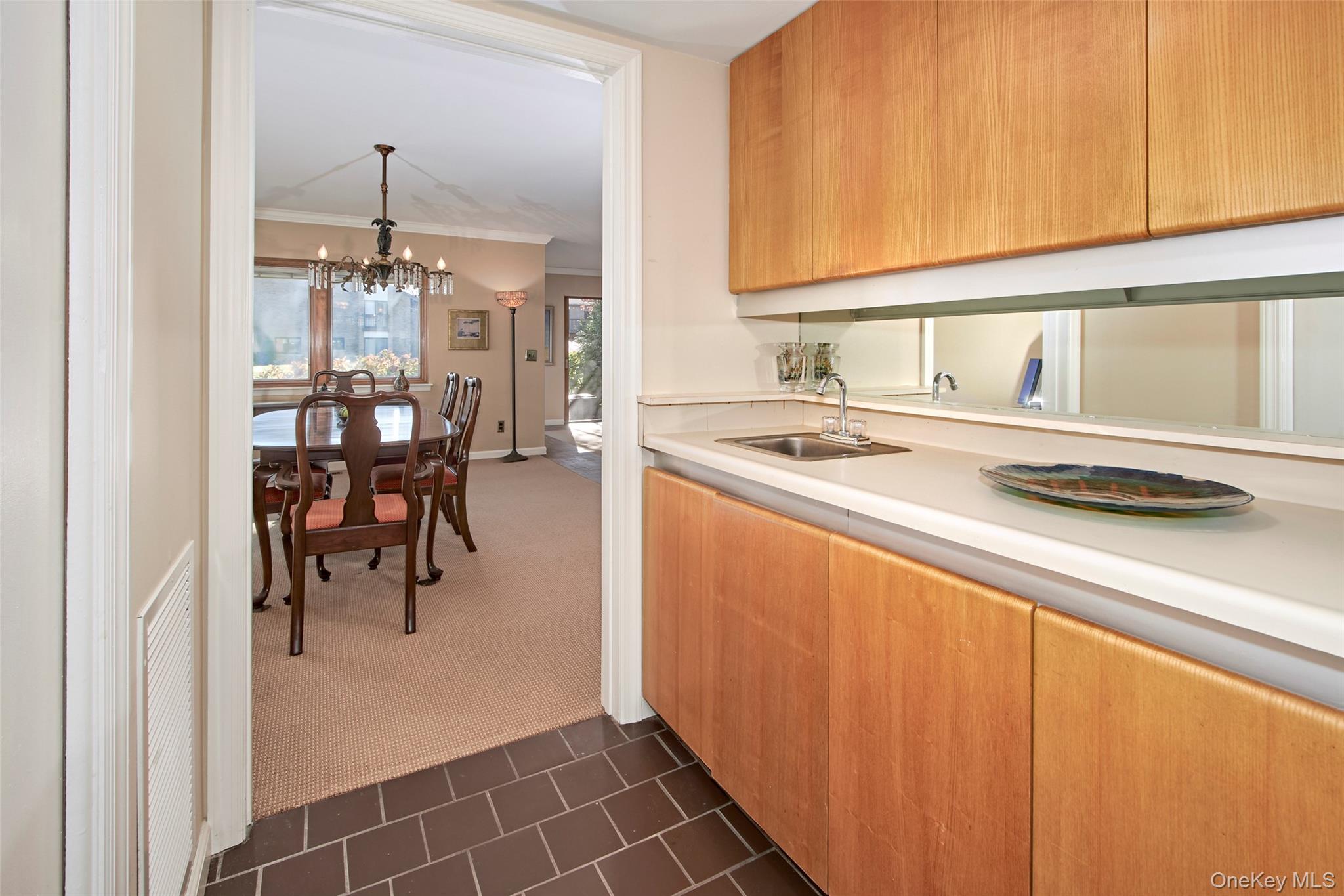 21 Waters Edge, Unit 21 Rye, NY 10580 - Photo 13 of 29 a kitchen with stainless steel appliances granite countertop a sink and a refrigerator