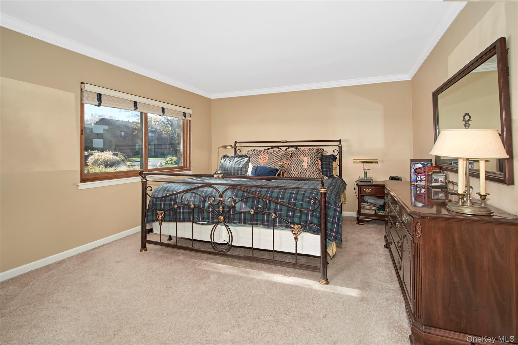 21 Waters Edge, Unit 21 Rye, NY 10580 - Photo 16 of 29 a bedroom with furniture and a window