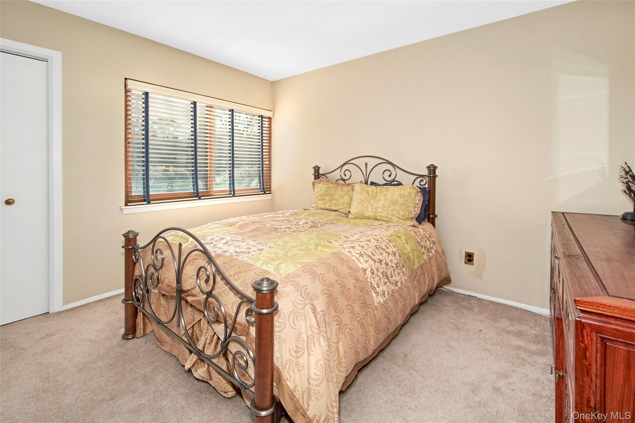 21 Waters Edge, Unit 21 Rye, NY 10580 - Photo 19 of 29 a bedroom with a bed and a window