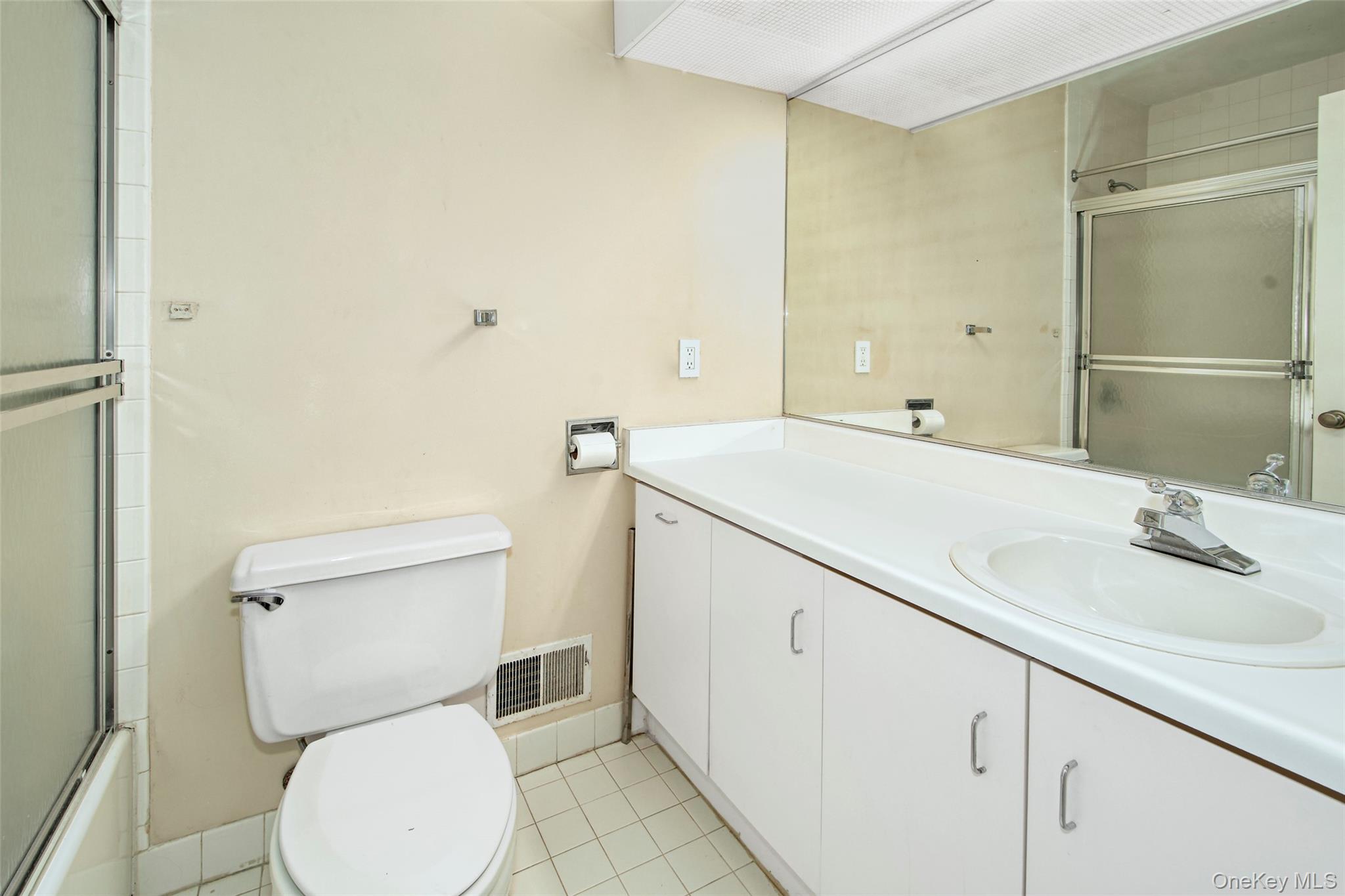 21 Waters Edge, Unit 21 Rye, NY 10580 - Photo 20 of 29 a bathroom with a sink a toilet and shower