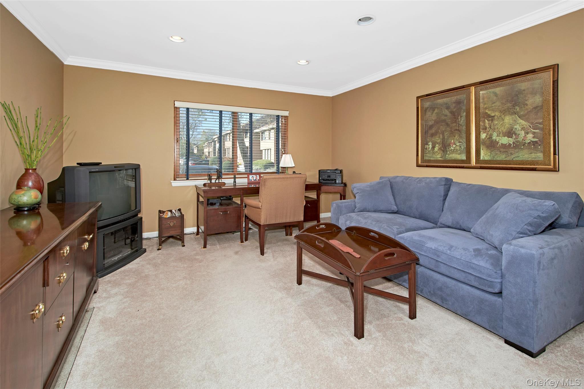 21 Waters Edge, Unit 21 Rye, NY 10580 - Photo 21 of 29 a living room with furniture and a flat screen tv