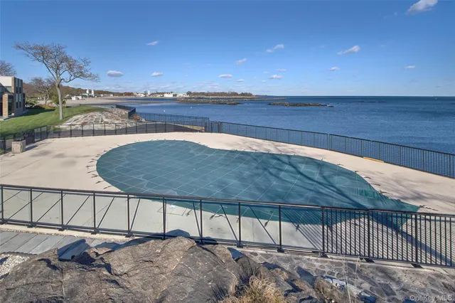 a view of a patio with a table and chairs