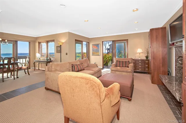a living room with furniture fireplace and flat screen tv
