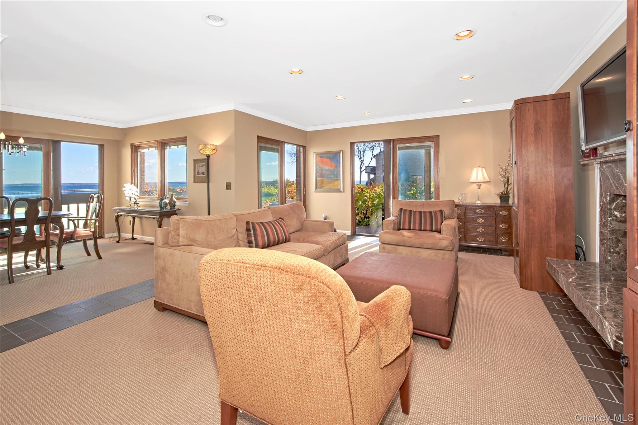 21 Waters Edge, Unit 21 Rye, NY 10580 - Photo 6 of 29 a living room with furniture and a large window