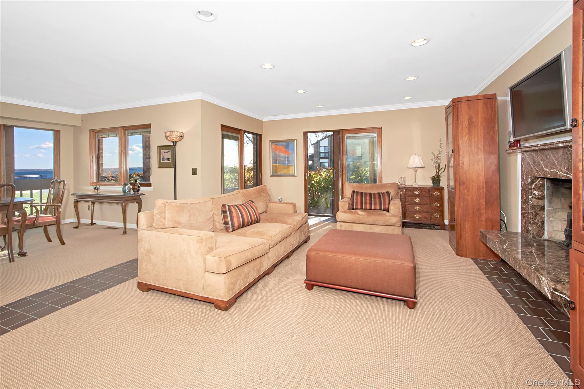 21 Waters Edge, Unit 21 Rye, NY 10580 - Photo 7 of 29 a living room with furniture fireplace and flat screen tv