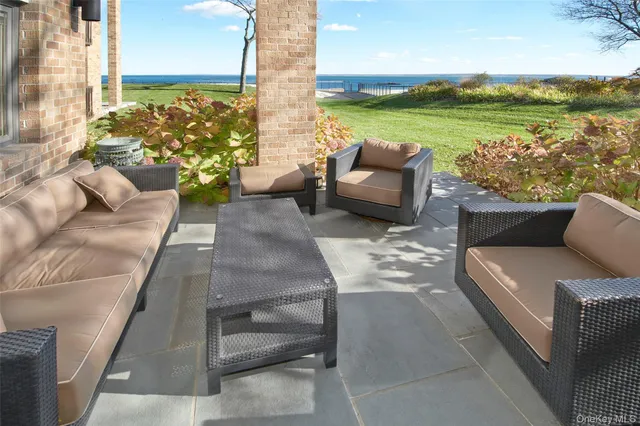 a dining room with furniture a chandelier and a rug