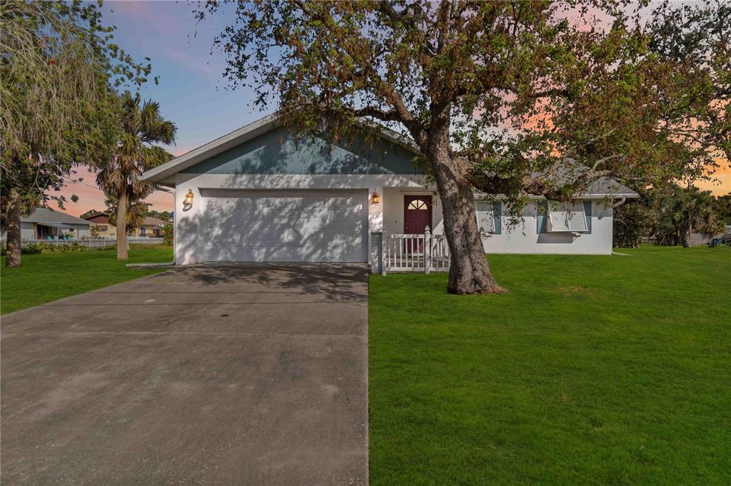 2281 Mars Road Venice, FL 34293 - Photo 1 of 1 a front view of a house with garden
