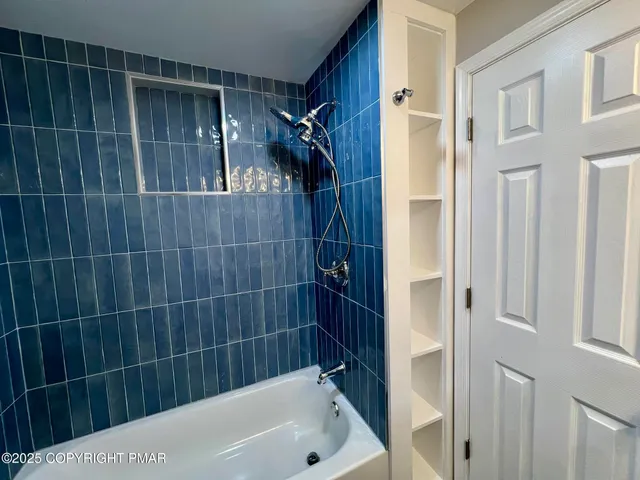 a bathroom with a bathtub