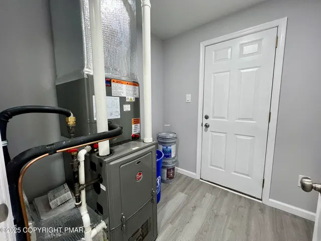 an entryway with wooden floor