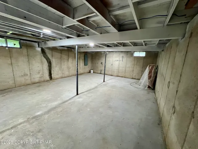a view of empty room with wooden ceiling
