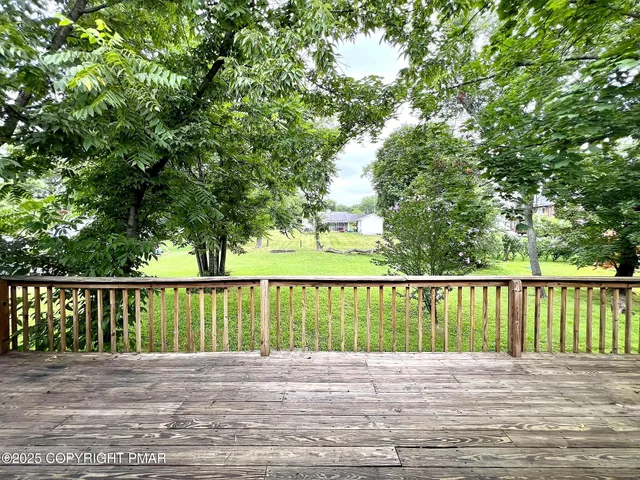 a view of balcony with wooden floor