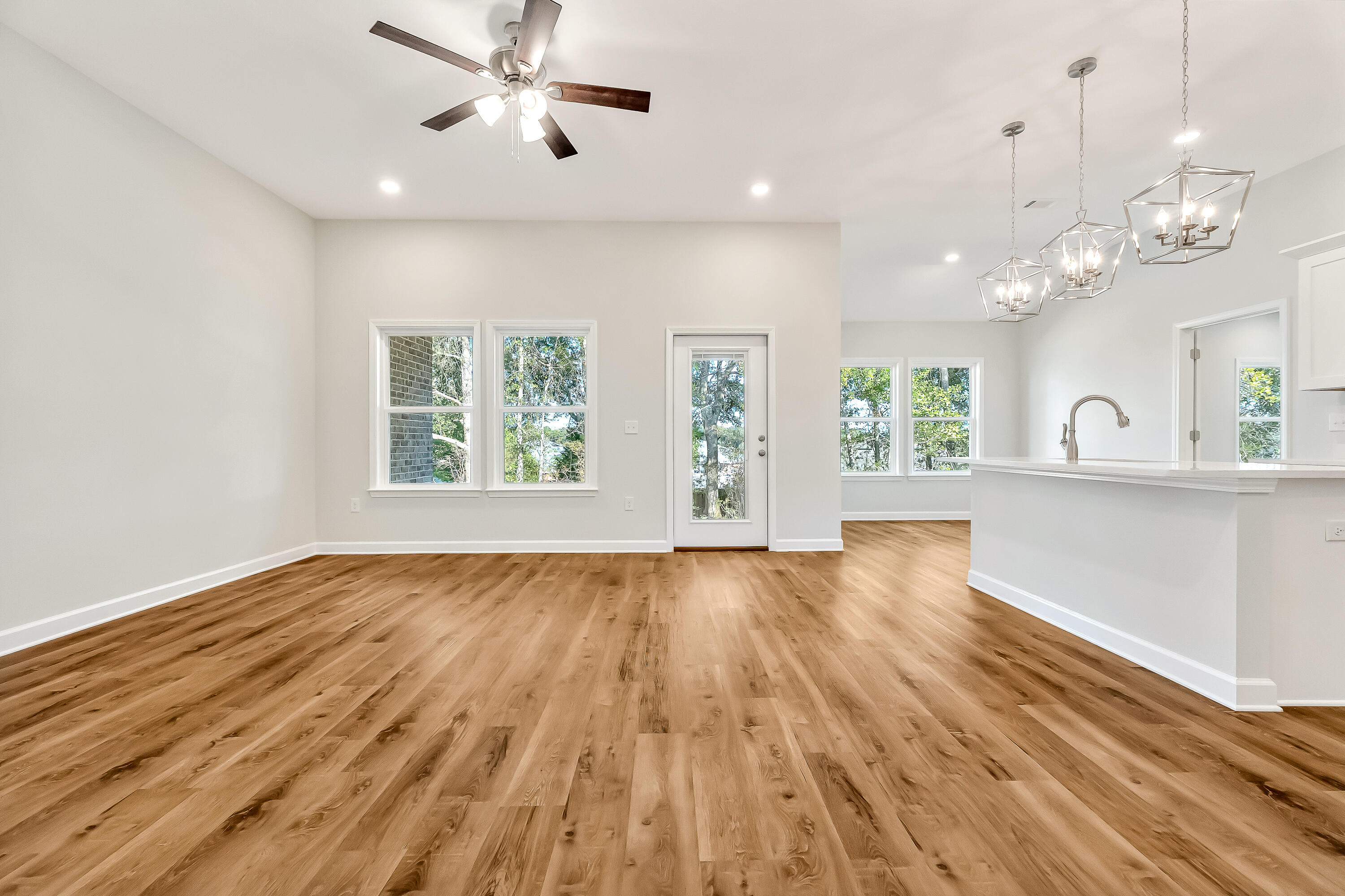 108 Huron Trail Crestview, FL 32536 - Photo 4 of 21 wooden floor in an empty room with a window